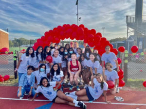 Celebrating the seniors, both junior varsity and varsity field hockey players pose for a team photo.
