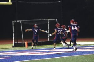 Justin Yoo (7) celebrates with his teammates moments after scoring his first touchdown of the game. On 2nd and 1, Yoo broke out for a 29-yard touchdown rush to give Jefferson the lead. “He [Justin] broke through 5 tackles and it genuinely deserves to go on SportsCenter,” senior kicker Joshua Park (13) said.  
