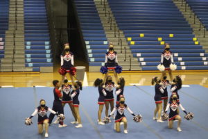 The Jefferson cheer team performs at the National District Finals Competition on Oct. 16. "I'm really proud of our team for accomplishing our routine." Julia Zherdetski said.