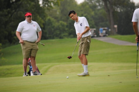Jefferson golfer and junior Allen Huo puts the ball in a win against Annandale High School on Aug. 30. The final score was 147-182.