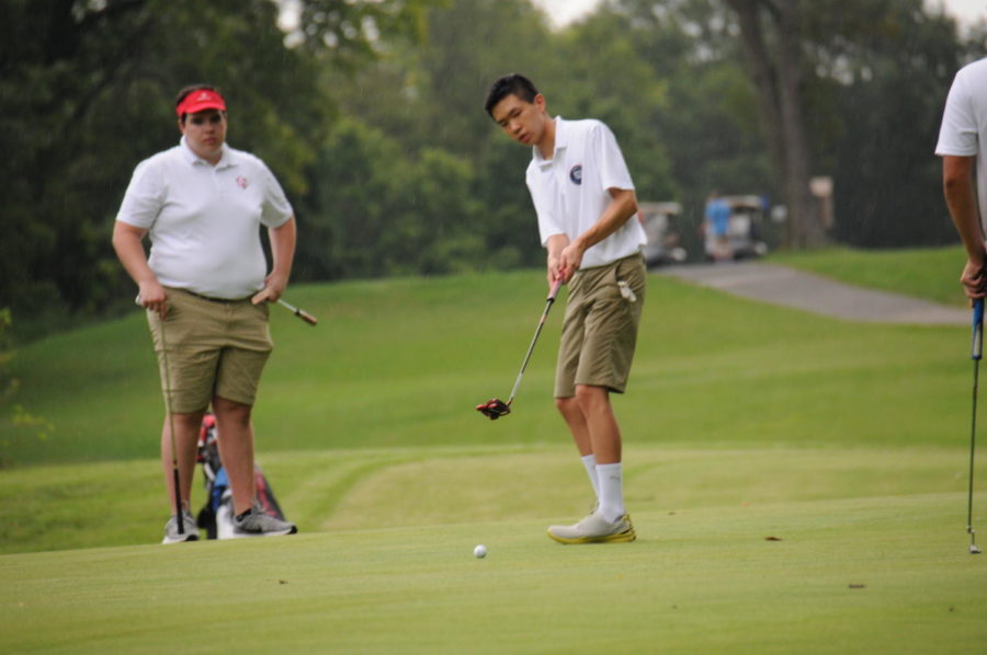 Jefferson+golfer+and+junior+Allen+Huo+puts+the+ball+in+a+win+against+Annandale+High+School+on+Aug.+30.+The+final+score+was+147-182.