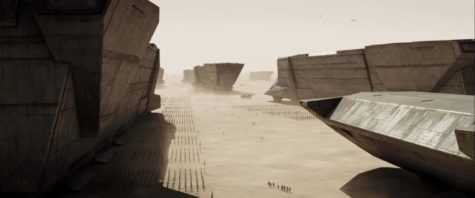 An armada of hulking space ships gathers on the sand planet Arrakis in “Dune”.