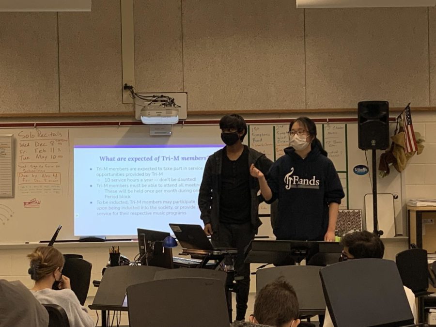  Symphonic wind ensemble representative Pranav Kuruba (left) and President Mira Kim (right) answer questions at the interest meeting on Nov. 22. “I think having a music honor society would really add a lot to our school,” Kim said. “I feel like it would give students a voice and help spread the love of music that we all share to a wider community.”