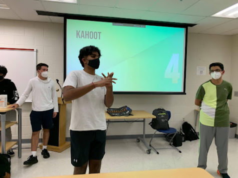 Sai Mattapalli (left) and Anish Susarla (right) introduce the Kahoot game after presenting about behavioral finance. The special collaboration during 8th period included a presentation on the basics of behavioral finance and ended with a game to get students involved. “We have lots of activities in the presentation so its not just a boring lecture. Its a pretty interactive presentation so we tried to [get] the whole room into the presentation so that no one is left out,” junior Arya Grayeli said. 
