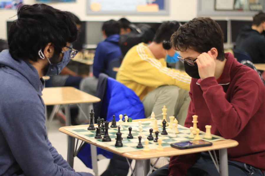 Nearing the end of their chess game, junior Kisna Matta (left) and senior Garrett Heller (right) think of their next moves. Heller is co-captain of Jefferson chess club, which meets every Friday during 8th period. “I was pressured [because] of time, but I think I ended up losing the game,” Heller said. 
