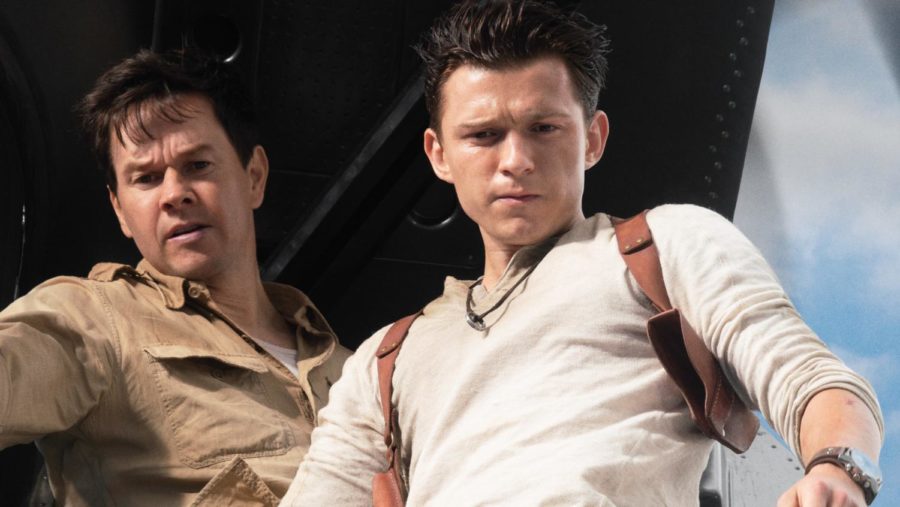 Tom+Holland+and+Mark+Wahlberg+as+Nathan+Drake+and+Victor+Sullivan+in+Uncharted+%282022%29.+