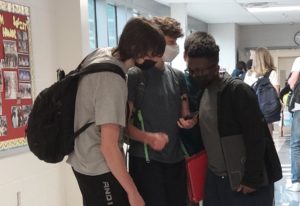 A group of freshmen (left to right: Tyler Clark, Maximillian Weinstein, Ramsses Arnez, Jarin Earle) catch up with each other during the ten minutes of passing time. 