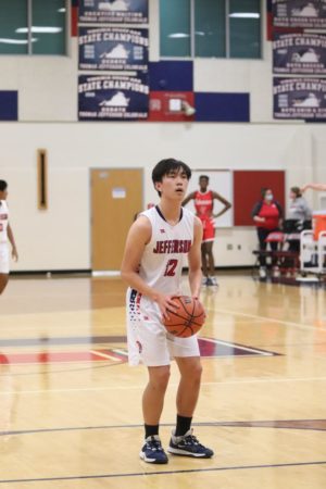 Focused on the net, senior and captain Steven Li lines up to take a free throw. Over the last few games of their season, Li has dominated the court. “There’s never a time when Steven’s on the floor that he's not giving his best effort,” head coach Mark Grey-Mendes said. 
