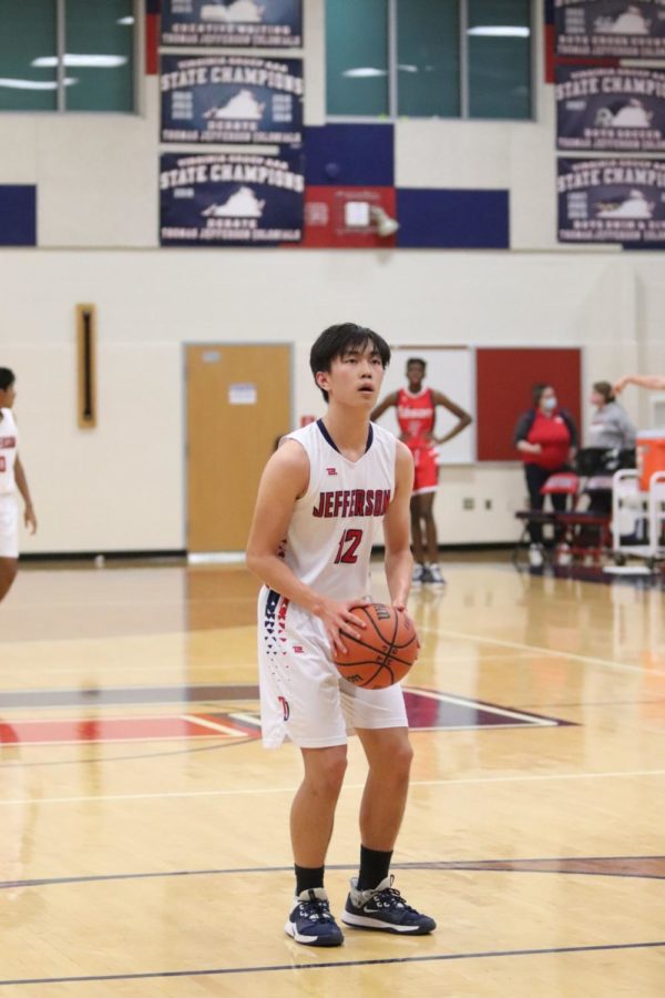 Focused on the net, senior and captain Steven Li lines up to take a free throw. Over the last few games of their season, Li has dominated the court. “There’s never a time when Steven’s on the floor that he's not giving his best effort,” head coach Mark Grey-Mendes said. 
