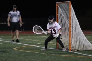 Senior captain and goalie Etienne Bauer prepares to stop a goal.