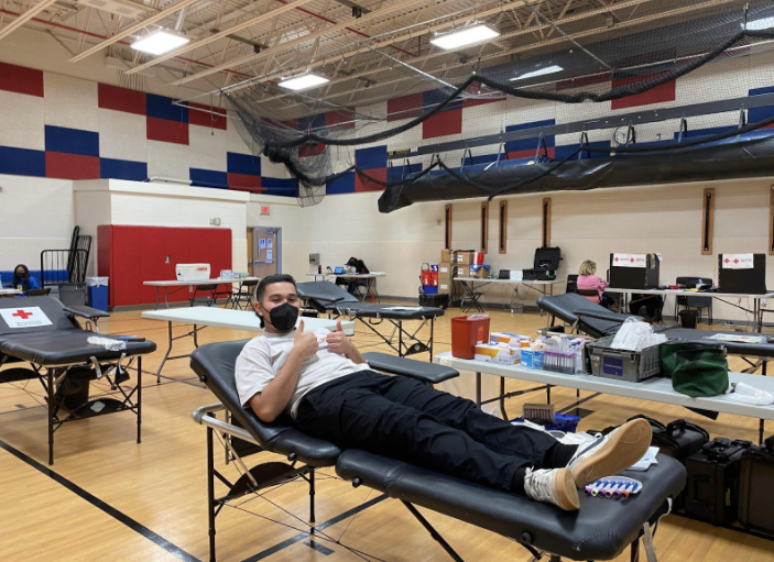 Senior+Chris+Arraya+is+one+of+the+many+people+who+donated+blood+on+March+25.+%E2%80%9CDuring+the+blood+drive%2C+we+worked+at+the+registration+booth+and+checked+in+all+of+the+donors+as+they+entered.+We+also+made+sure+that+all+donors+were+hydrated+and+well-fed+so+everyone+was+in+the+best+condition+to+donate%2C%E2%80%9D+Senior+Pagadala+said