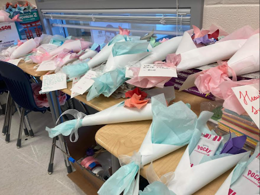 The pocky bouquets created by JNHS being held in the Japanese room. “We sold out of our stock really quickly, it must have been Thursday I think.” Kwon said.