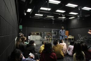 Abhi Badia plays the role of president in the TJ Improv Workshop. The game of President is when one person goes into another room, and then the class make up a law and act as the press  towards the president, as the president returns, the press start asking questions to give the president clues on the law they supposedly made.