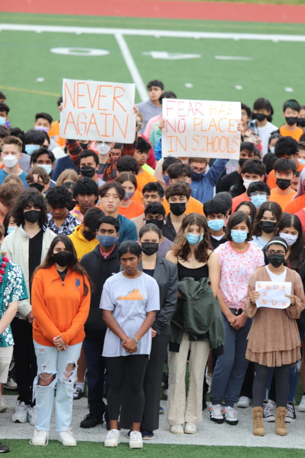 Students stand solemnly during the five minute moment of silence. 