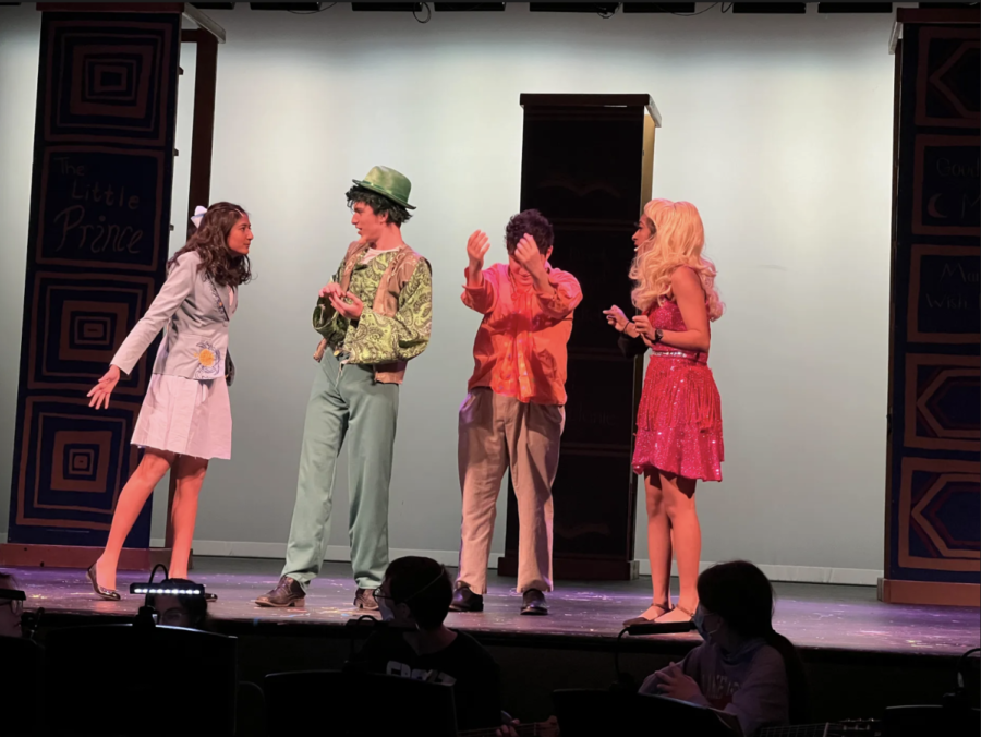 Seniors Sarina Saran, Aafreen Ali, and Jack Baisch and junior Gabriel Ascoli rehearse for their performance Wednesday Apr. 27. Saran plays Matilda as she confronts her family, the Wormwoods, played by Ali, Ascoli, and Baisch. "[Matilda]'s really smart ... she is mistreated a lot but she likes to stand up for what is right," Saran said.