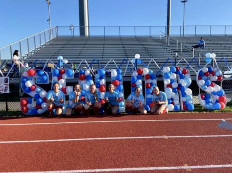 Seniors (from left to right) Ashley Lee, Lexie Skeen, Sydney Belt, Andrea Silva, Alex Fall, Kailyn Pudleiner, sit in front of the balloons. “It was a really fun night and a cool way to celebrate the seniors,” sophomore Emi Curtis said. 