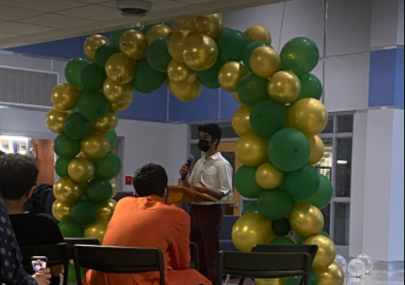 Freshman Hussain Al-Sadig addresses the attendees of the festival, reading aloud the Quran, the main religious text in Islamic religion.