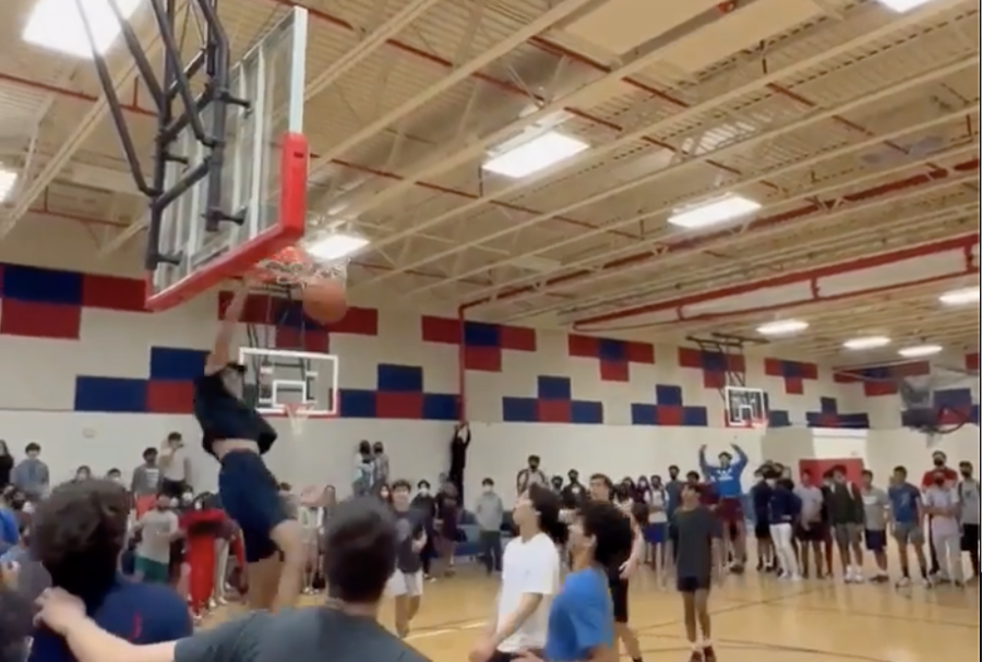 Sophomore Sahil Kapadia throws down a dunk against ‘Goon Squad”. “My favorite moment from the Jday tournament was by far Sahil’s dunk because that’s not something you see every day,” junior Audhav Durai said.  