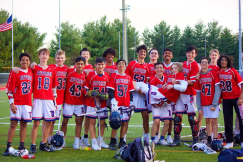 The boys JV lacrosse team poses for a photo after winning the last game of the season, and capping off an undefeated season. “I think the season went well and we definitely improved as it continued,” freshman Jake Foster said.