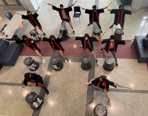 Japanese Culture Club members perform taiko drumming during the middle of J-day.
