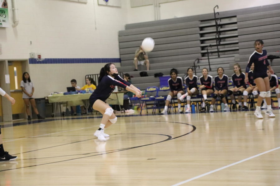 Senior Rachael Sim goes down to bump the ball in Jefferson volleyball's first win of the season. "Although we had a couple of losses prior to this game, before our game on 8/29 we did our best to keep a positive and focused mindset. We were optimistic and had faith in our combined abilities to win, but we kept in mind that we had to put out our best effort," junior Jessica Chen said