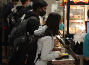 Caption: Students line up to get food from the Jefferson cafeteria. [This policy is] mostly behind the scenes, were trying to eliminate some food waste is all, junior and Treasurer Matt Sprintson said.
