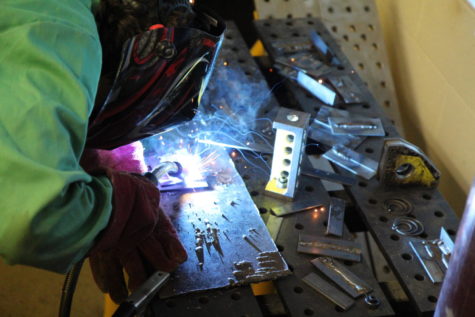 Junior Shaun Fallon welds a part in the Prototyping Lab. TJ Engineering would give those in other labs access to tools such as welding stations, which as of now are available only in the prototyping lab.