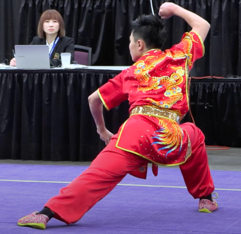 Kooc is in the middle of his routine at the 2022 United States National Team trials. He went on to qualify for the national team and compete in the Pan American Wushu Championship held in Brasilia.