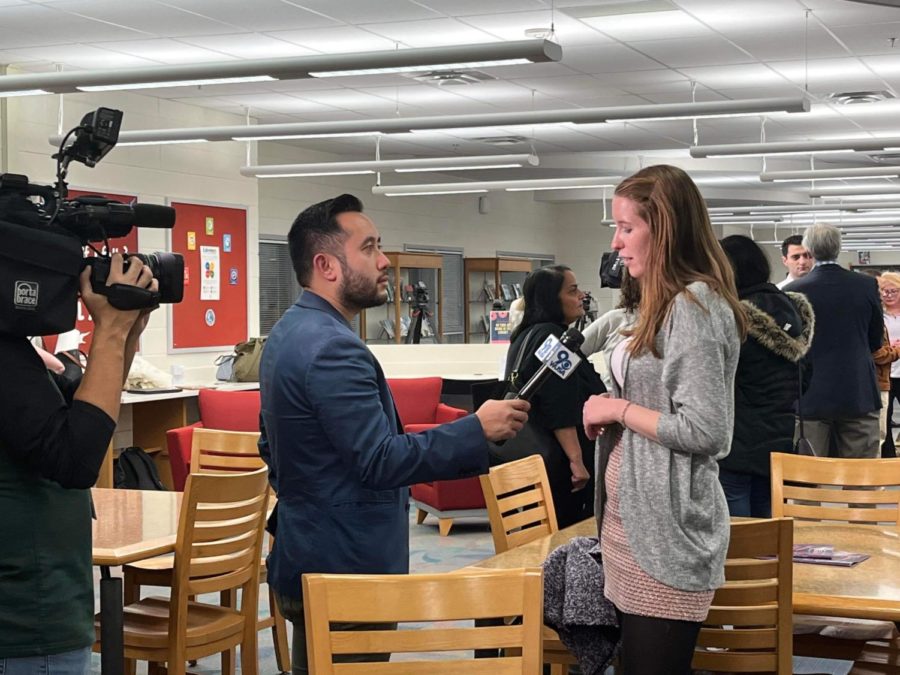 At Jefferson’s library, a meeting attendee is interviewed by a news reporter. After school on Jan. 3, a meeting was held with Superintendent Dr. Reid to discuss the delay in giving students their letters of commendation. 