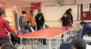 Students gather in Newton commons to watch the ongoing match between seniors Utkarsh Goyal and Manav Barath in the morning before 5th period starts. Ever since winter break, Goyal has been bringing in ping pong paddles and a net, starting a routine activity between him and his friends. “I was looking for a spot to play, realized some set of tables was perfect, and pretty much started from there,” Goyal said. 