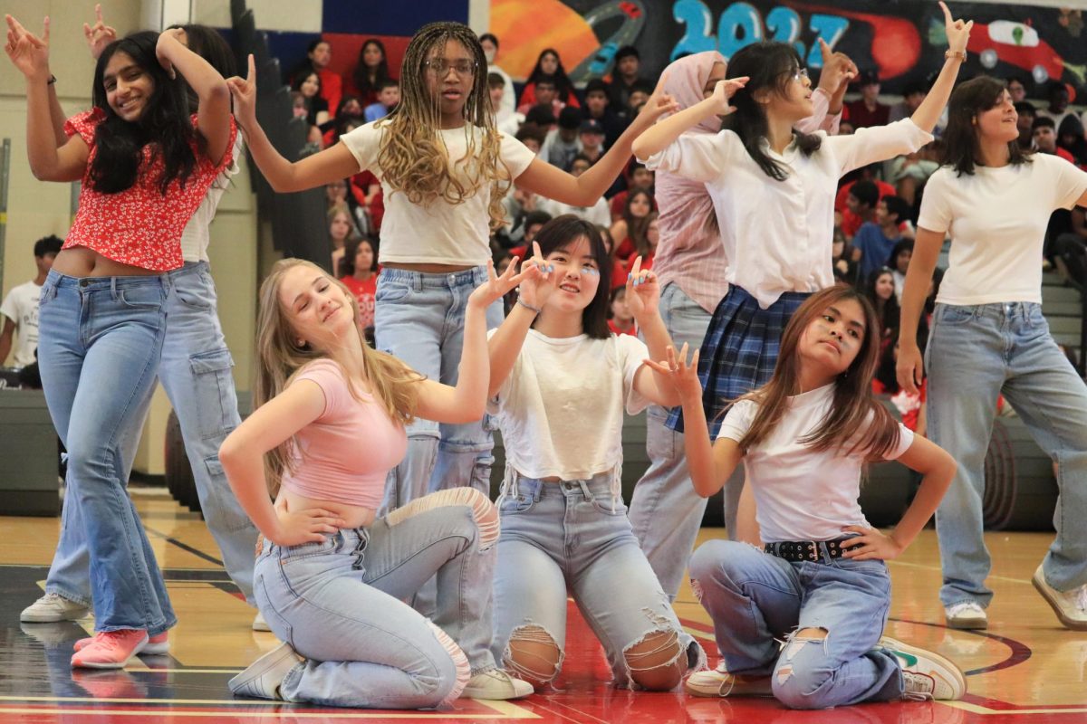 During a dance to a mashup of “Wannabe” and “Vogue,” junior Mandy Huang, bottom middle, lifts her hands at the end, striking a pose with the other junior dancers. “At first, [MEX] was stressful because practices went by so quickly and it felt like I would never be able to memorize the choreography, but the choreographers were amazing,” Huang said. “When we were about halfway to Homecoming, turnout to practices was so low that one of our choreographers brought bomb pops to try and lure people back into MEX.”