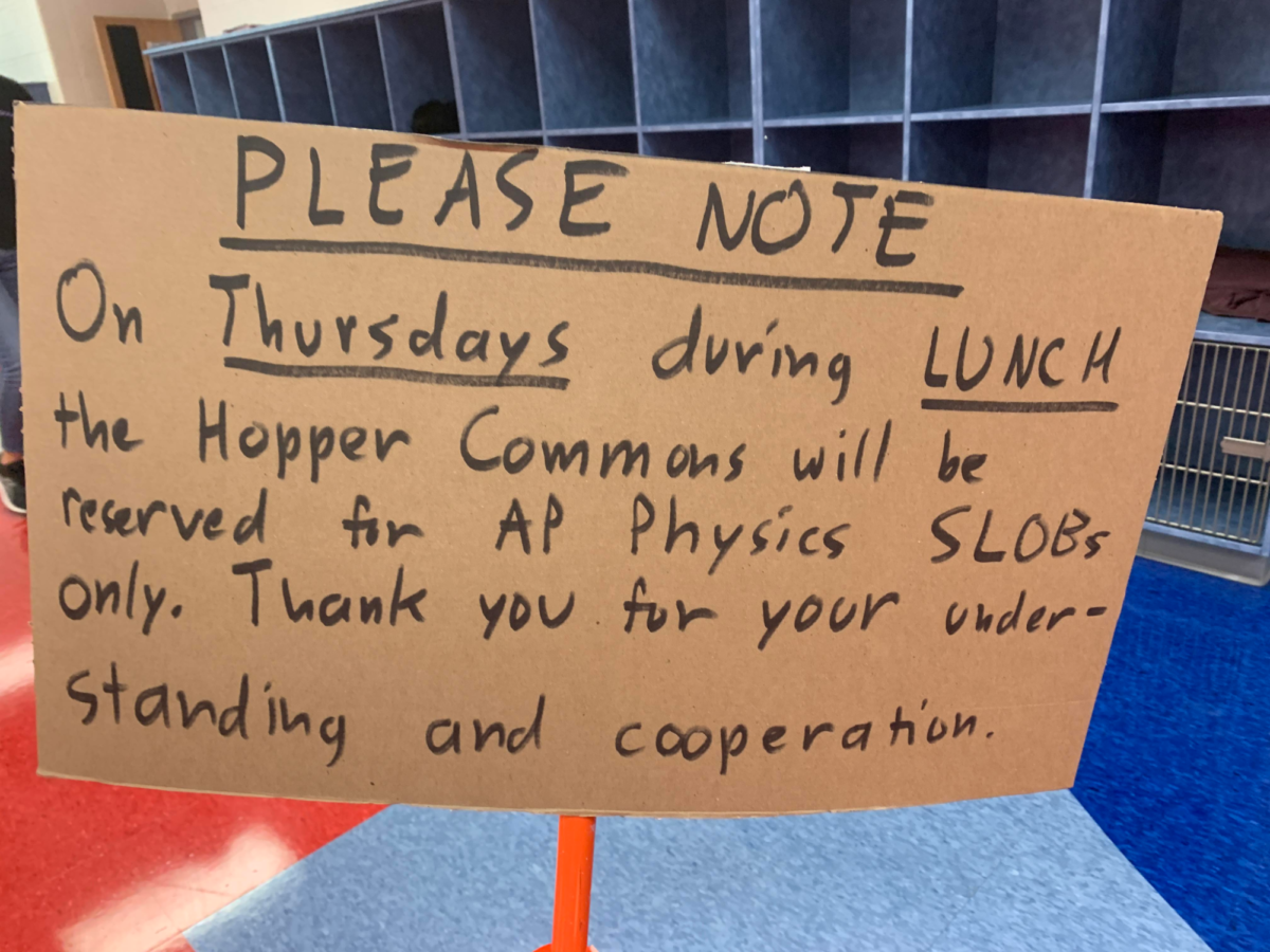 Blocking+your+way+into+the+Hopper+Commons+is+this+sign+that+discourages+other+students+from+eating+lunch+here.+Every+Thursday%2C+this+sign+makes+sure+that+AP+physics+students+have+the+ideal+environment+to+focus+on+the+SLOB.+%E2%80%9C%5BLast+week%E2%80%99s%5D+SLOB+had+a+very+high+success+rate%2C+much+higher+than+I+actually+thought%2C%E2%80%9D+Mark+Hannum%2C+the+Optics+Lab+Director%2C+said.