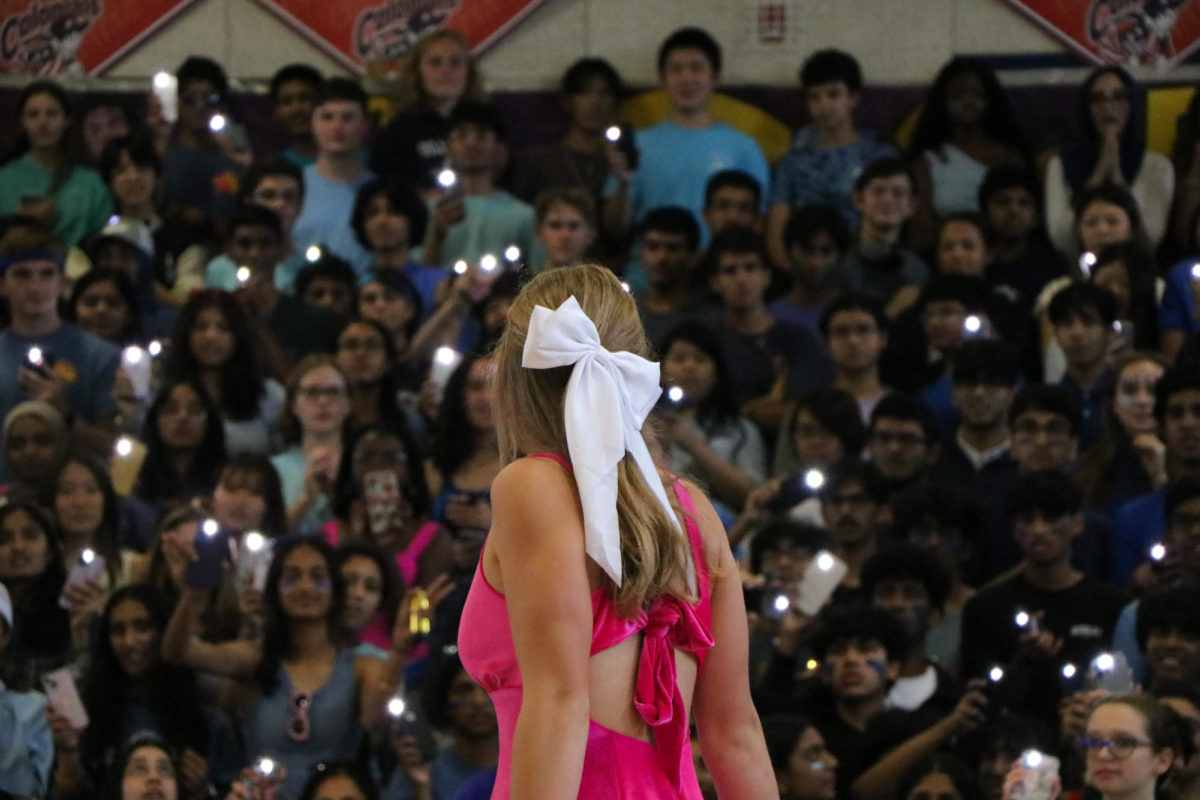 During the pep rally on Friday, Sept. 22, junior June Anderson turns towards the junior class as she performs a sequence based on a scene from “Barbie” (2023). “We wanted to connect ‘Oppenheimer’ (2023) to the part in that dance where Barbie has her thoughts about death,” Anderson said. “She's like, ‘Here's everything about death,’ and then we were gonna drop a bomb on everyone. They were all gonna fall back and then confetti was gonna go up and everyone was gonna start dancing to Nicki Minaj.” 