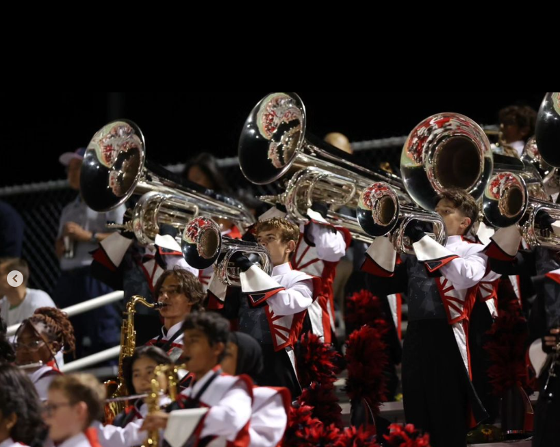 Taking over the blaring crowd with their sound, the trombones add a commanding presence to the marching band’s musical ensemble during the Back to School Bash. “You get a lot of adrenaline when you’re playing,” junior John Yao. “You just finish a really hard piece and the crowd goes, yeah, [TJMC] is so cool. You have three or four moments during your show so it’s pretty cool.”