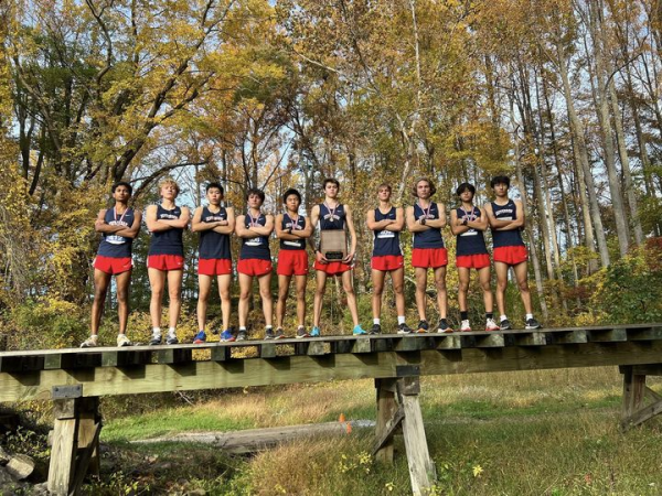 Caption: The ten runners pose with their celebratory plaque after winning first place at the district meet. Sophomore Max Zhou shares how the team is pivoting efforts towards the state meet. “We did well as a group at the district meet, and the same for the regional meet. We will try our best in the states as well,” Zhao said.