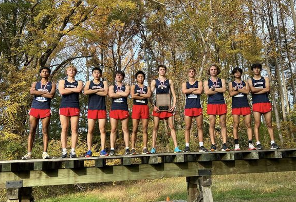 Caption: The ten runners pose with their celebratory plaque after winning first place at the district meet. Sophomore Max Zhou shares how the team is pivoting efforts towards the state meet. “We did well as a group at the district meet, and the same for the regional meet. We will try our best in the states as well,” Zhao said.