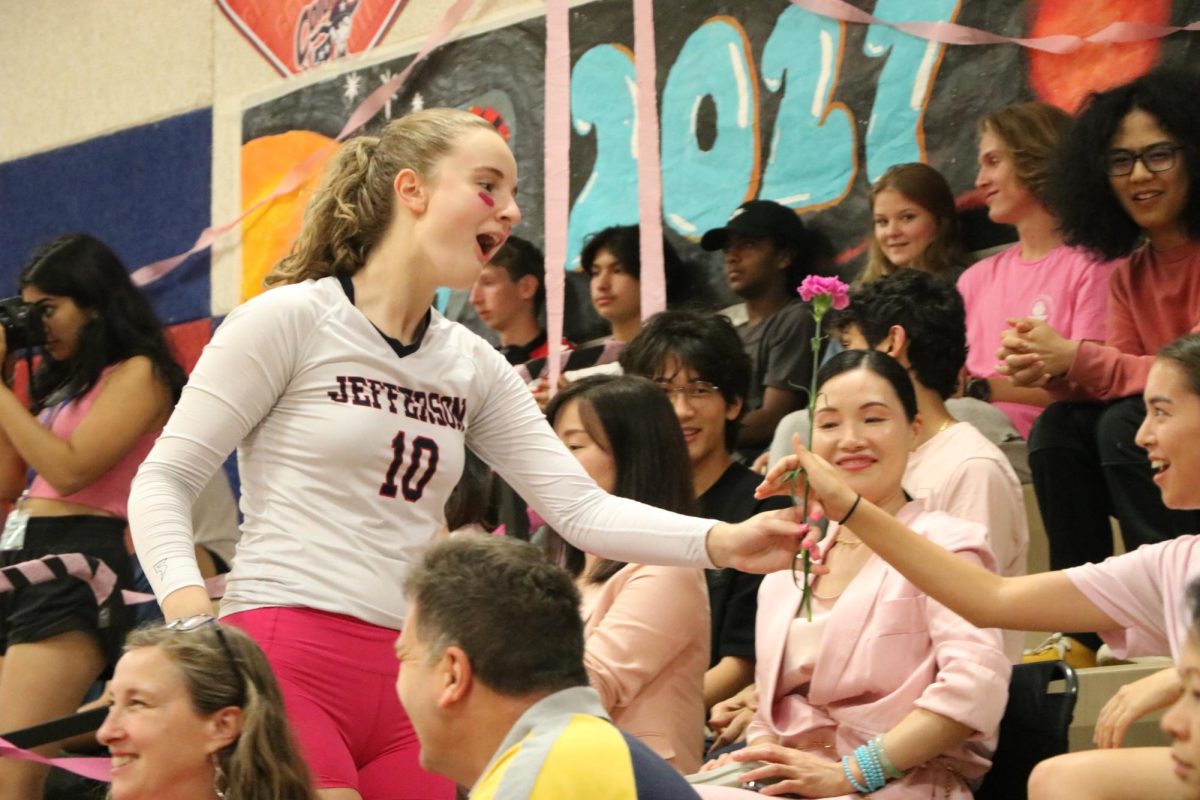 In addition to their pink outfits, balloons and streamers, a tradition for Dig Pink is the distribution of carnations to the crowd, “I gave my carnation to my friend Emi Curtis.
I picked her just because she’s the one that comes to see my games. I think for me, it’s just a nice tradition for showing appreciation for someone,” Dubay said.