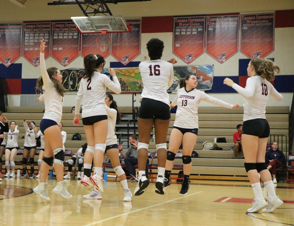 Performing their signature cheer, the varsity team celebrates an ace. “We’ve had a lot of new setters come in and work really hard at setting the right tempo. We've had a lot of people switch positions and work pretty hard to adjust to that. Everybody being willing and able to adjust to what the team needs when the team needs it is really what I think has been responsible for us being as successful as we are,” Steward said. 