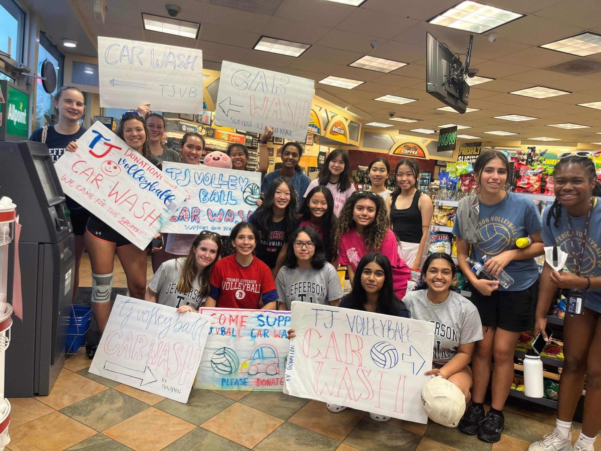 The team stands with their advertising signs inside Sunoco after finishing their seasonal car wash fundraiser. Events such as these double as opportunities for team
bonding, which benefits the program in the long run. “Everybody who wears a TJ volleyball t-shirt is fully in it, and fully committed. I think that’s why it’s so easy for us to lean on each other and help each other out when we’re in those low energy moments
because we spend like a lot of time together off the court,” Stewart said.