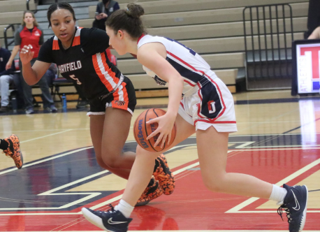During a game against Hayfield last year, junior Helena Johnson dribbles across the court. This season, the Jefferson cheer team will be performing courtside at all varsity basketball games. “I didn’t know too much about basketball, but after two games, I caught on,” sophomore cheerleader Caitlyn Wood said. “I think [sideline cheer] is good to have the crowd engaged and keep encouraging the team to do their best.”