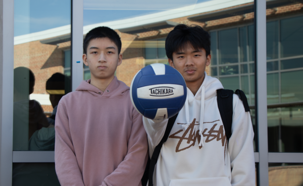 Palming the ball, freshman Tony Wang stands with sophomore Eric Cai, representing a part of boys volleyball. “The club has gotten more teams and gotten more competitive. But it [has the bandwidth to] become [even] bigger and become a real sport,” Wang said.