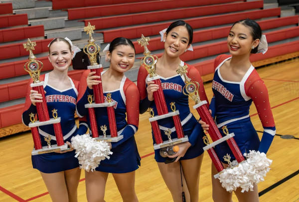 The Jefferson dance team holds up their trophies for the camera. They placed first in kick and second in lyrical, pom, and jazz. “[Dance] is just really fun,” junior captain Grace Xiao said. “The community and also [our] coach are really chill. Captains have a lot of flexibility.”