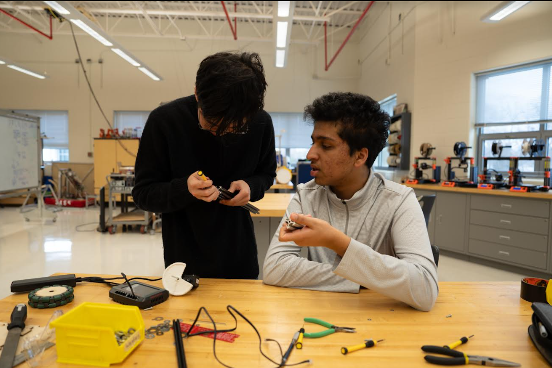 Juniors Taiki Yamauchi and Hari Harish assemble their Robotics 1 final project, a robot that can play a game of Rocket League in real life. With both projects and standardized exams available as options of testing student knowledge, it is vital for Jefferson to find the balance between the two. 
