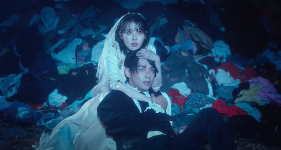 Ji-hye (IU) and Tae-jun (V) hold tightly onto each other as they face their death from the cube device. 