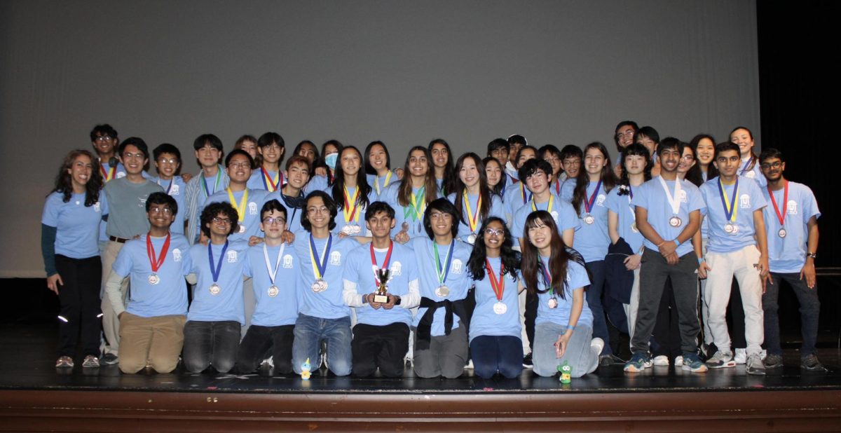 All three of Jefferson’s Science Olympiad teams pose with their medals on Virginia Tech’s auditorium stage. “It went really well,” senior event director Adi Desai said. “We competed against mainly teams from Virginia, and placed highest among all the teams that competed.” 