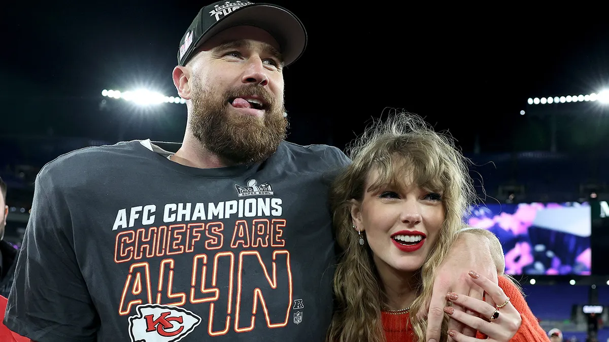 Pop star Taylor Swift and NFL tight end Travis Kelce embrace after the Kansas City Chiefs defeated the Cincinnati Bengals 23-20 in the AFC Championship Game. Their relationship has sparked numerous controversies throughout 2023, including people recently criticizing the NFL's overdone showings of Swift during games. 
