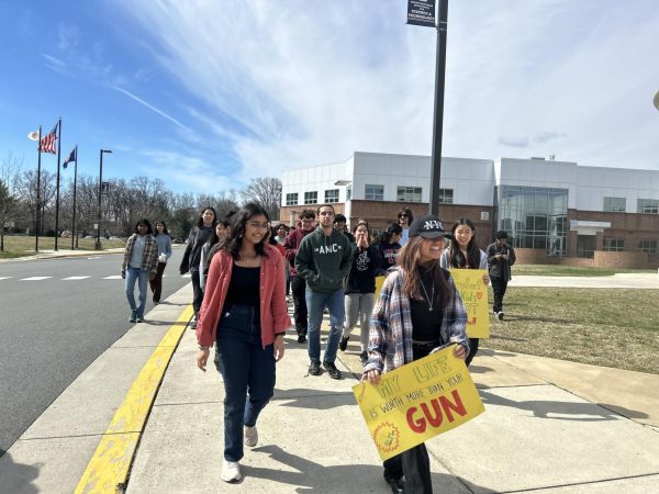 Walking out of the school in protest of gun violence, sophomore Moubon Kurukumbi and the members of the “Done With Guns” organization make their way to the track field. “Back in middle school, we tried to do something like this but it never really worked out,” Kurukumbi said. “Once I got to Jefferson, I realized I needed to make an impact and I heard they did walkouts for other stuff in the past, so I thought it would be a good idea to start an organization called ‘Done With Guns’ to help organize walkouts, and email legislators.”