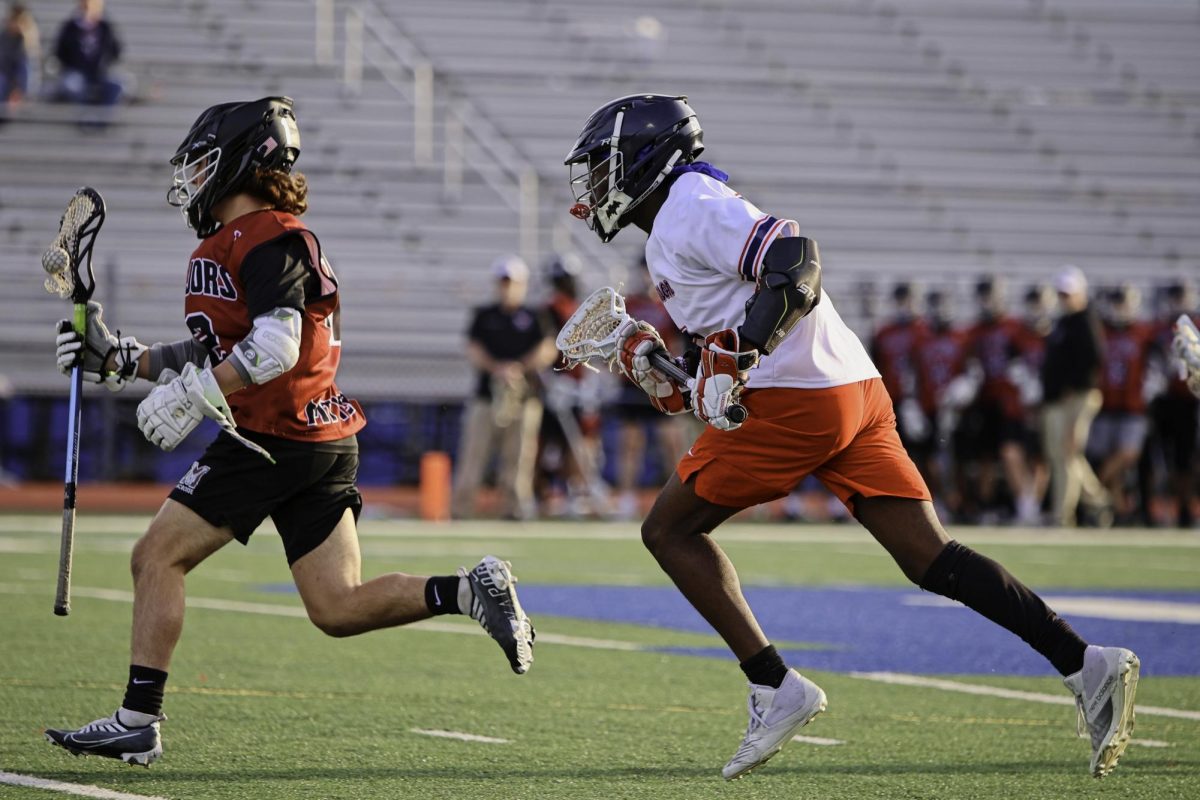 Running across the field in a game against Mount Vernon, sophomore Abdul Bundu fasts for Ramadan all while playing on Jefferson’s Varsity Lacrosse team. “Iftar is usually right at the start of a game or in the middle of the game. I usually play the first quarter of the game without any food in my system, and then once it’s dark, I sub out and break my fast,” Bundu said. 