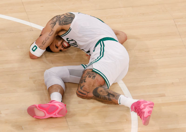 During Game 4 of the Eastern Conference Semifinals against the New York Knicks,  Boston Celtics’ forward Jayson Tatum falls to the floor in pain after tearing his right Achilles tendon.
