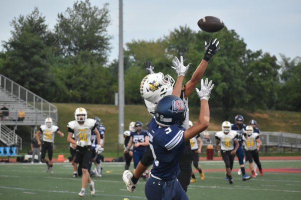A defensive player from Jefferson guards a Buck receiving a pass. “You can never really expect that much [going into a game], but you can't go in there not expecting to have some kind of challenge,” sophomore football player Wyatt Lilley said. “There's always going to be something that you don't expect.”
